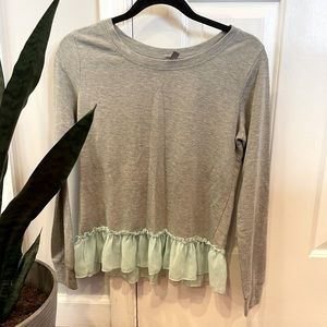 Grey long sleeve tee with seafoam ruffle hem